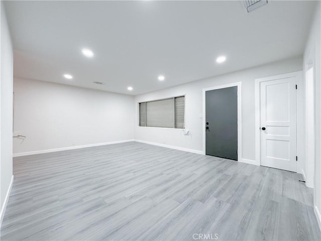 unfurnished room featuring light hardwood / wood-style floors