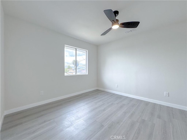 unfurnished room featuring ceiling fan and light hardwood / wood-style flooring