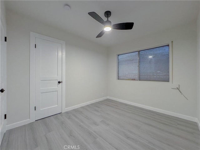 unfurnished room featuring ceiling fan and light hardwood / wood-style flooring