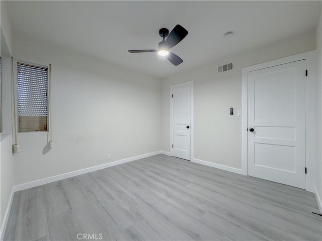 unfurnished bedroom with ceiling fan and light hardwood / wood-style flooring