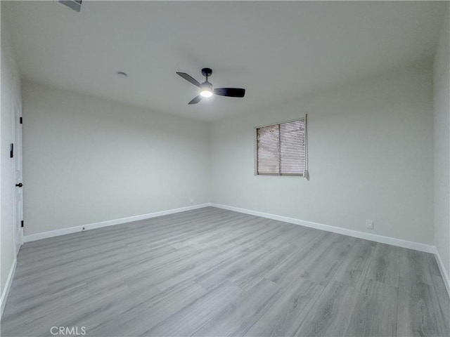 empty room with light hardwood / wood-style flooring and ceiling fan