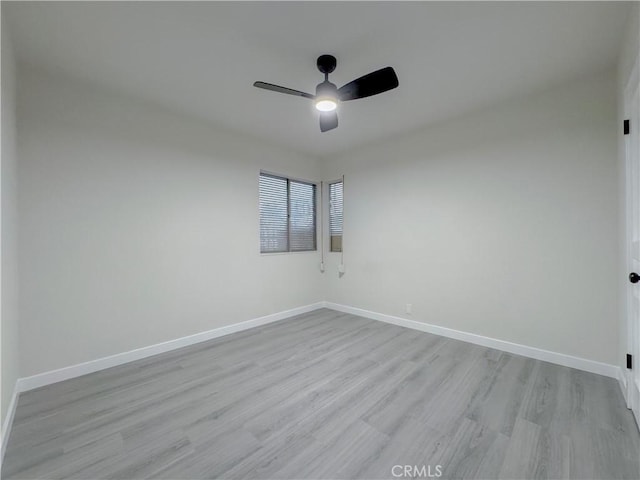 spare room with ceiling fan and light hardwood / wood-style flooring