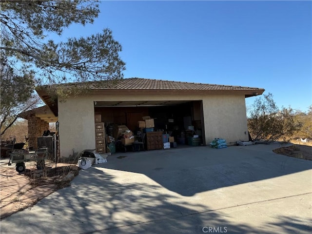 view of side of property featuring a garage