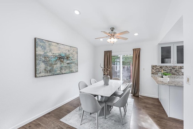 dining area featuring lofted ceiling, dark hardwood / wood-style floors, and ceiling fan