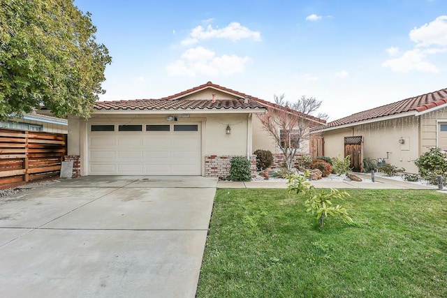 view of front facade with a garage and a front lawn