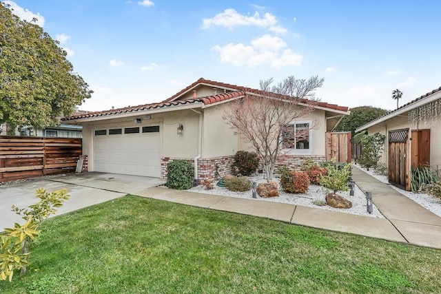 view of front of home with a garage and a front lawn