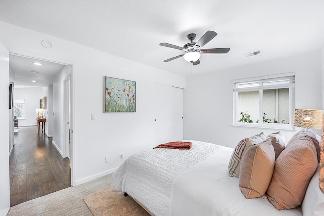 bedroom featuring ceiling fan and hardwood / wood-style floors