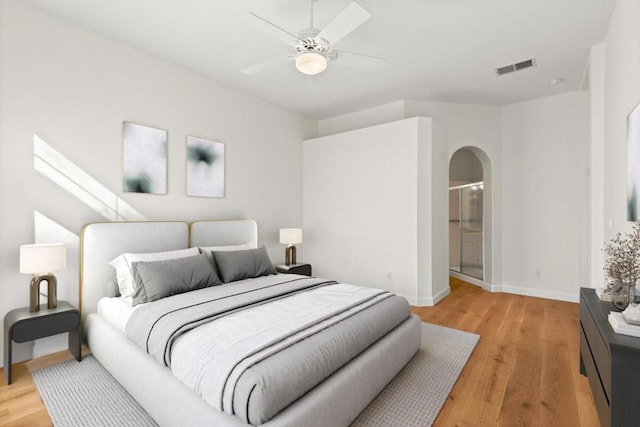 bedroom with ceiling fan and light wood-type flooring