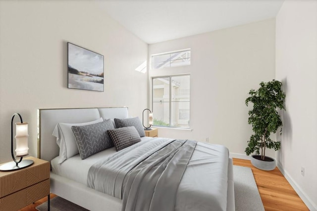 bedroom with hardwood / wood-style floors