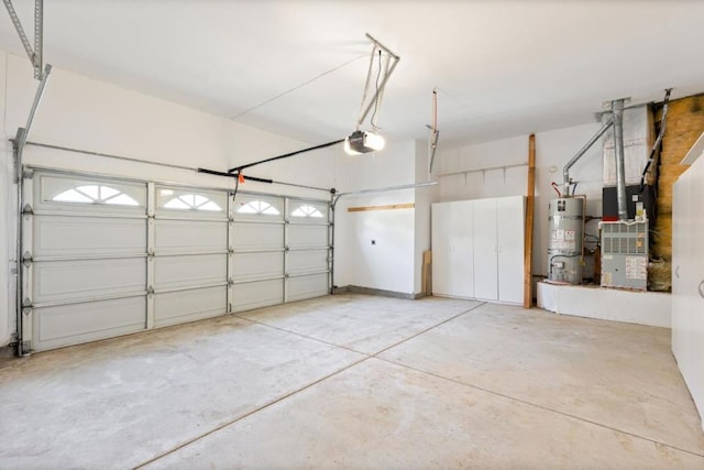 garage with secured water heater and a garage door opener