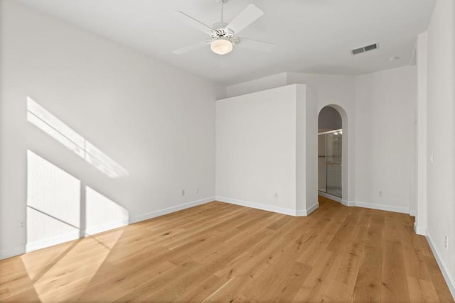 empty room featuring ceiling fan and light hardwood / wood-style floors