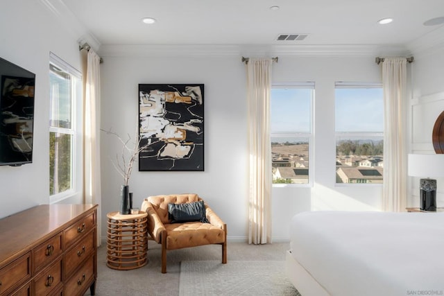 carpeted bedroom with ornamental molding