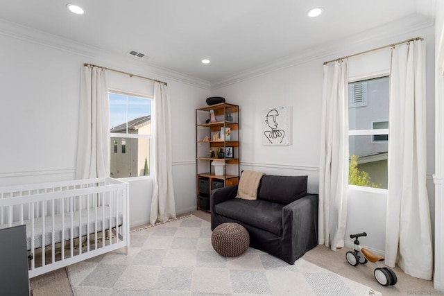 bedroom with crown molding and light colored carpet