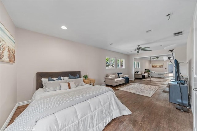 bedroom with hardwood / wood-style floors and ceiling fan