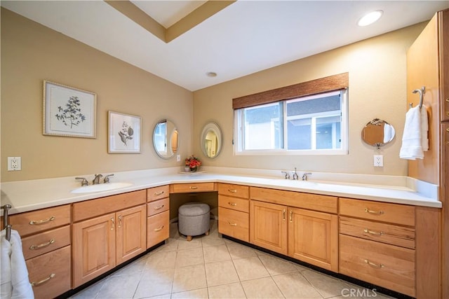 bathroom with tile patterned flooring and vanity