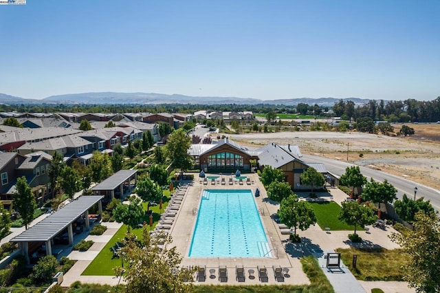 birds eye view of property featuring a mountain view