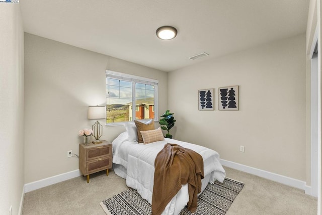 bedroom with light carpet