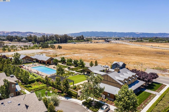 birds eye view of property with a mountain view