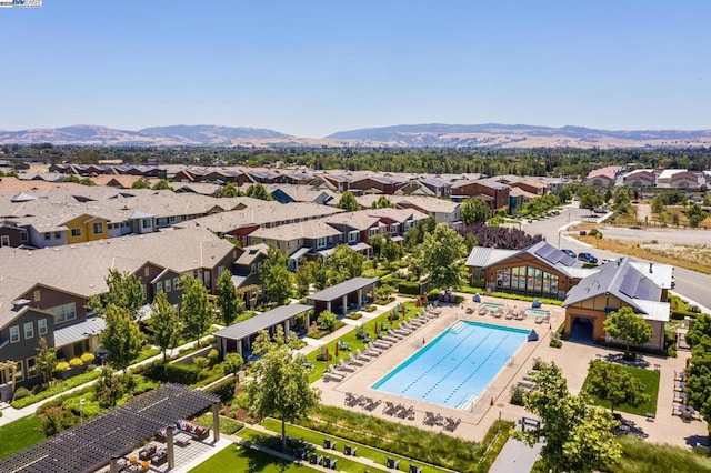 birds eye view of property featuring a mountain view