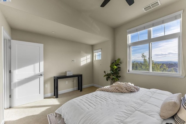 carpeted bedroom featuring ceiling fan