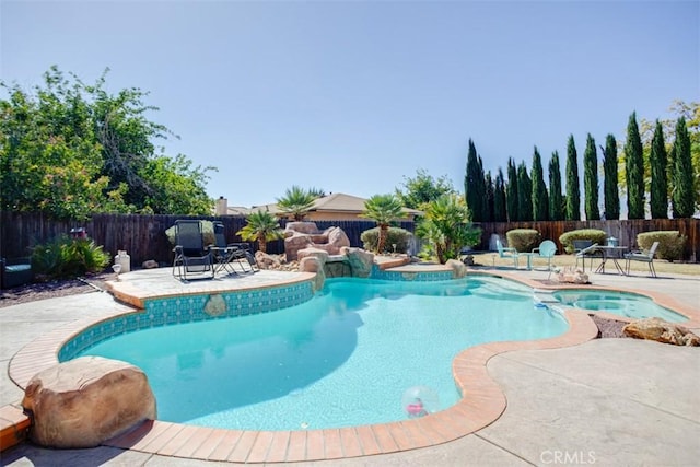 view of swimming pool with a patio area