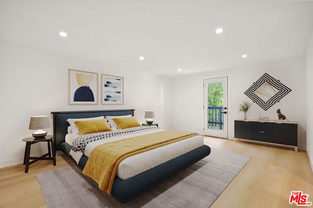 bedroom featuring access to outside and light wood-type flooring