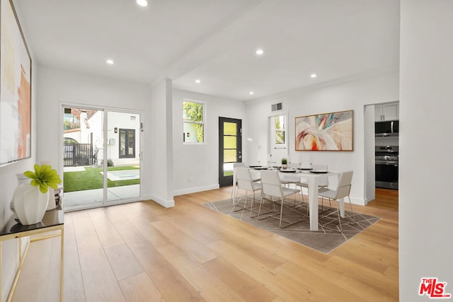 dining space with light wood-type flooring