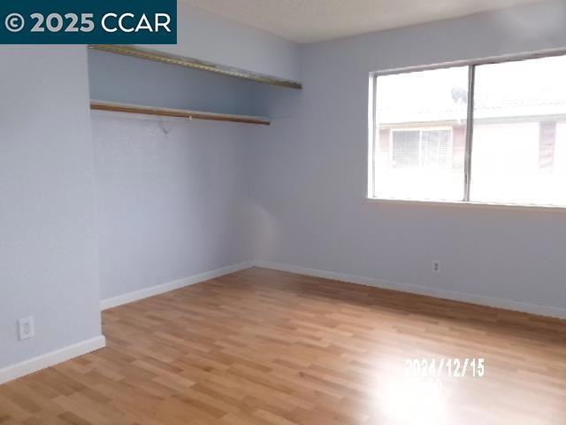 unfurnished room featuring light wood-type flooring