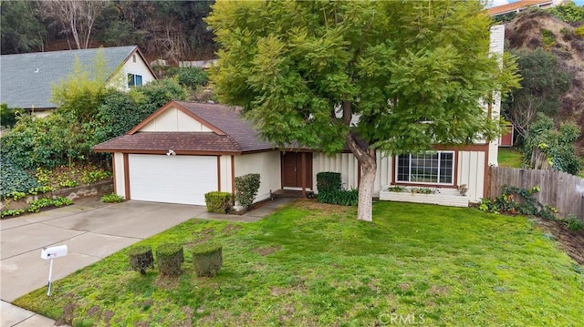 view of front of home with a garage and a front lawn