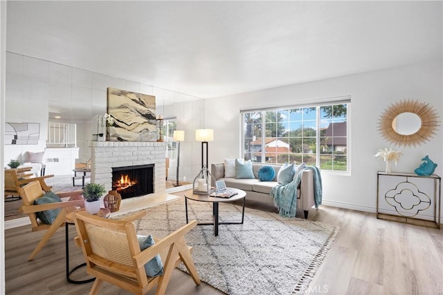 living room featuring hardwood / wood-style flooring and a fireplace