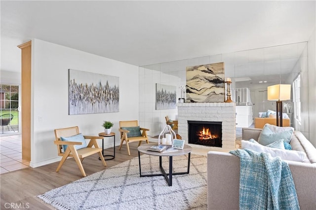 living room featuring hardwood / wood-style flooring and a fireplace