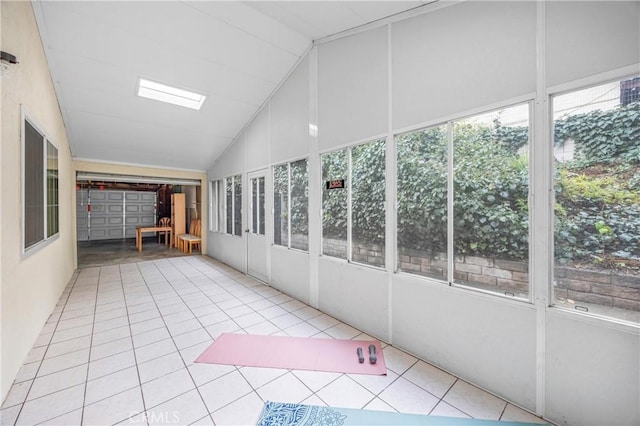 unfurnished sunroom with vaulted ceiling and a healthy amount of sunlight