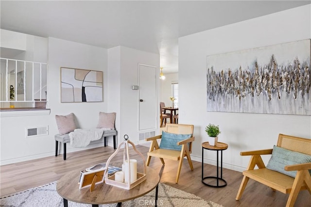 sitting room featuring light hardwood / wood-style flooring