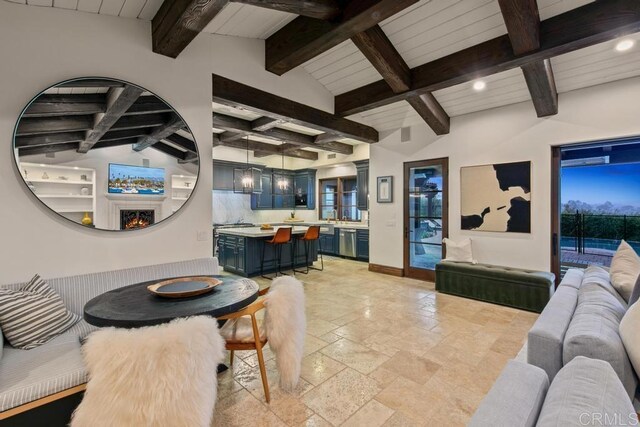 dining room featuring recessed lighting, baseboards, stone tile floors, and vaulted ceiling with beams