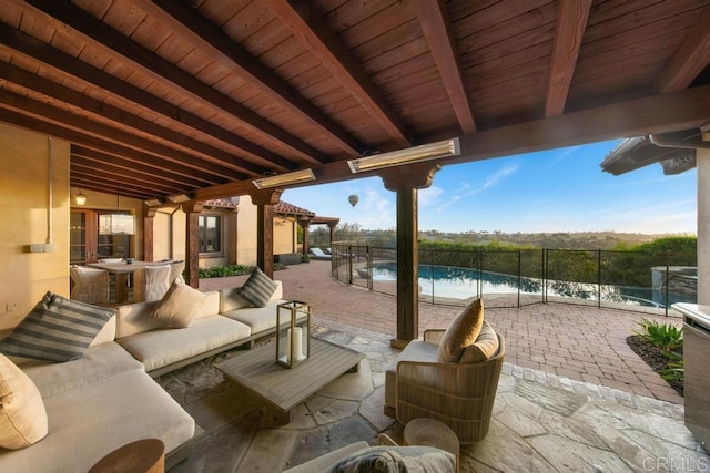 view of patio / terrace featuring a fenced in pool, outdoor lounge area, and fence