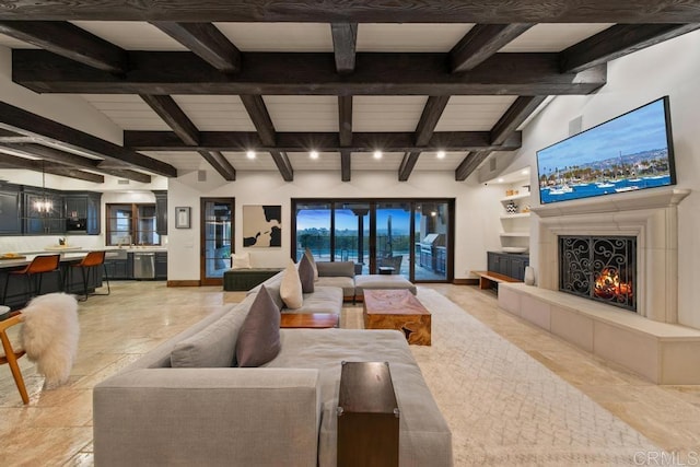 living area with beamed ceiling, baseboards, and a warm lit fireplace