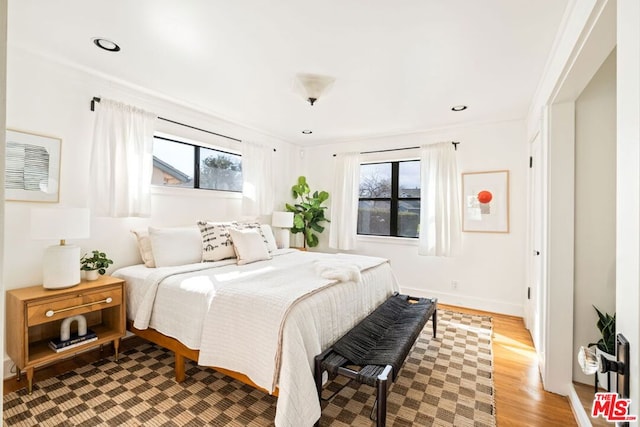 bedroom featuring light wood-type flooring