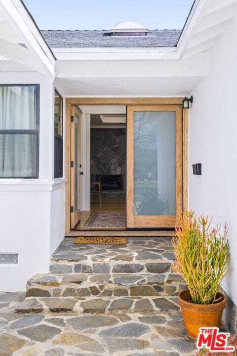 entrance to property with a patio area