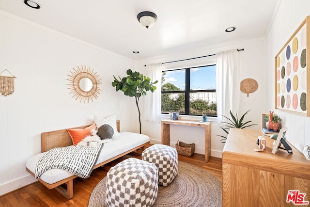 bedroom featuring hardwood / wood-style flooring and crown molding