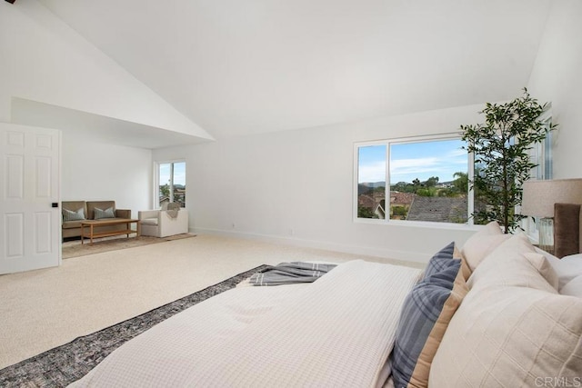 carpeted bedroom with baseboards, multiple windows, and high vaulted ceiling