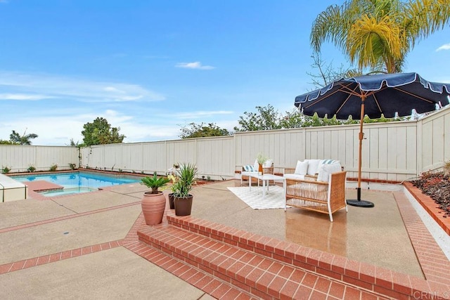 exterior space with a patio area, a fenced backyard, an outdoor hangout area, and a fenced in pool