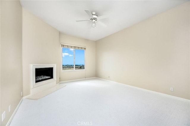 living room featuring ceiling fan and carpet