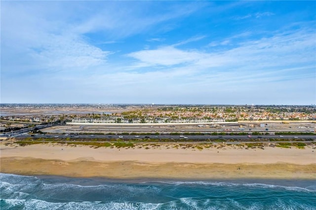 aerial view featuring a water view and a view of the beach