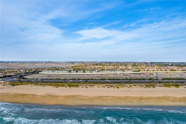 birds eye view of property with a beach view