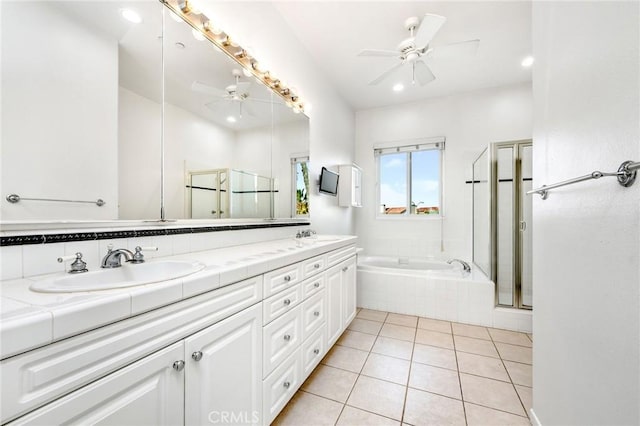 bathroom with a ceiling fan, a sink, a shower stall, tile patterned flooring, and a bath