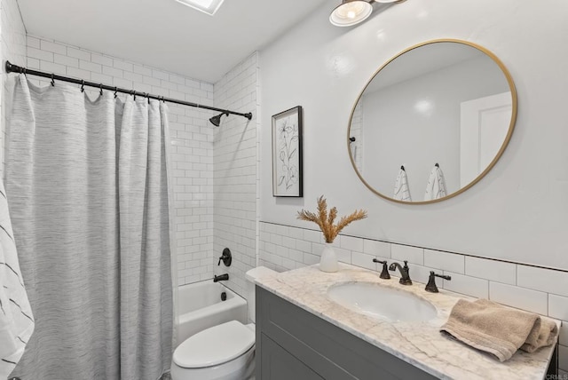 full bathroom with shower / bath combo, tile walls, vanity, and toilet