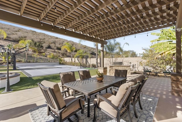 view of patio featuring a mountain view and a pergola