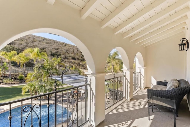 balcony featuring a mountain view