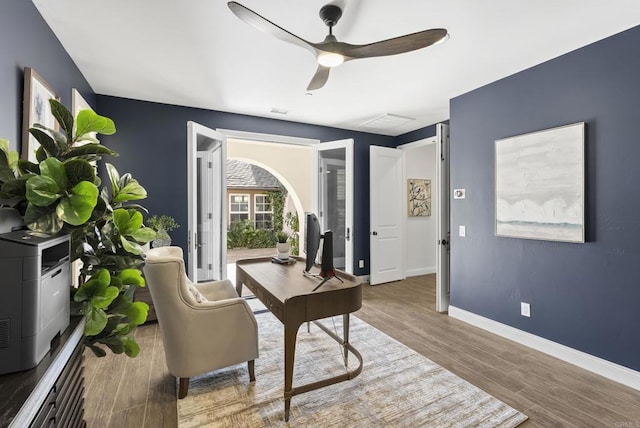 office with hardwood / wood-style floors and ceiling fan