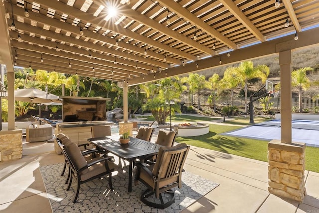 view of patio featuring a bar and a pergola